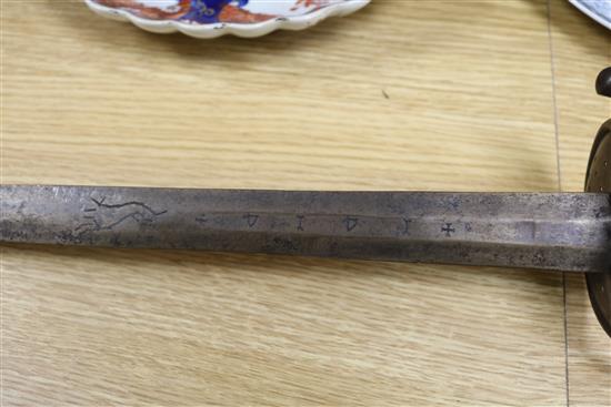 A Turkish sidearm and a cagework hilted sword